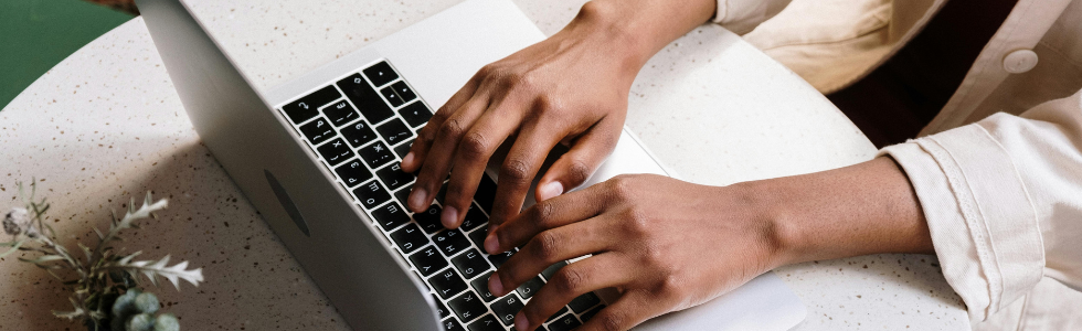 Woman signing up for email on laptop